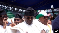 Atiku Abubakar, presidential candidate of the People's Democratic party, Nigeria's opposition party, speaks with his supporters during a presidential election campaign rally in Yola Nigeria, Feb. 18, 2023. 