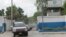 FILE - A convoy of cars carrying members of a Kenyan delegation leave the premises of Haitian National Police after meeting with Frantz Elbe, chief of the Haitian National Police, in Port-au-Prince, Haiti, Aug. 21, 2023. 