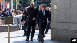 FILE: Ed Sheeran walks into Manhattan federal court, April 25, 2023, in New York. A jury decided his song "Thinking Out Loud" did not copy Marvin Gaye's "Let's Get it On" as alleged.