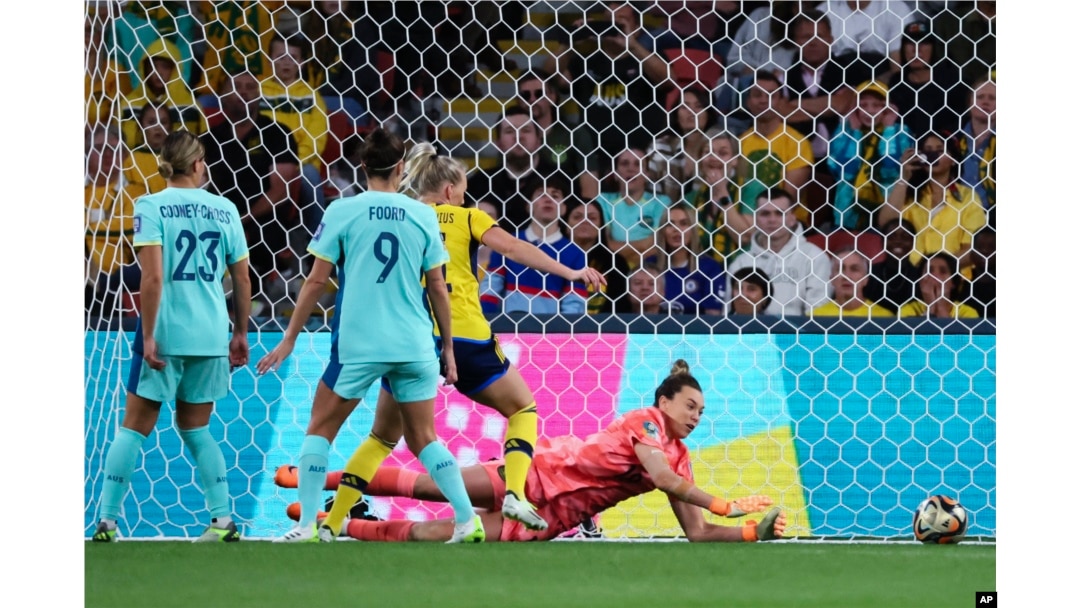 Australia's goalkeeper Mackenzie Arnold dives to make a save during the Women's World Cup third place playoff soccer match between Australia and Sweden in Brisbane, Australia, Aug. 19, 2023.