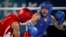 In this photo provided by the International Olympic Committee, Maksym Halinichev of Ukraine, right, competes against Abdumalik Khalokov of Uzbekistan during the Youth Olympic Games in Buenos Aires, Argentina, Oct. 18, 2018. 