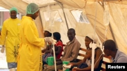 FILE - Patients are treated at a clinic dealing with cholera outbreak in Harare, Zimbabwe, September 19, 2018. 