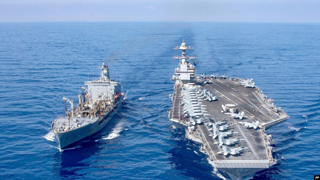 The USS Gerald R. Ford aircraft carrier refuels from the underway replenishment oiler USNS Laramie in the eastern Mediterranean Sea, Oct. 11, 2023. (U.S. Navy photo via AP)