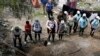 Relatives search for their missing loved ones in a clandestine grave in Zumpango, Mexico, April 19, 2024. 