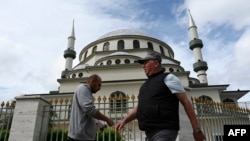 FILE - Muslims leave the Gallipoli Mosque after the first congregational Friday prayers held in the holy fasting month of Ramadan, in Sydney on April 16, 2021.