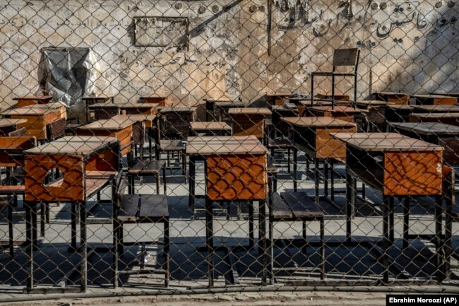 FILE - The benches of a school sit empty in Kabul, Afghanistan, Thursday, Dec. 22, 2022. The country's Taliban rulers have banned girls from middle school, high school, and most jobs. Women are also banned from parks and gyms. (AP Photo/Ebrahim Noroozi)