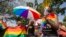 FILE - Ugandan activists gathered for a gay pride rally, celebrating one year since the overturning of a strict anti-homosexuality law in Entebbe on August 8, 2015. 