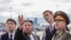 In this photograph distributed by the Russian Defense Ministry, North Korea's leader Kim Jong Un, second from left, and Russia's Defense Minister Sergei Shoigu, right, visit Knevichi aerodrome near Vladivostok, Russia, Sept. 16, 2023.