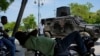 Police patrol in an armored vehicle in the Champ de Mars area of Port-au-Prince, Haiti, April 24, 2024.