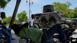 Police patrol in an armored vehicle in the Champ de Mars area of Port-au-Prince, Haiti, April 24, 2024.