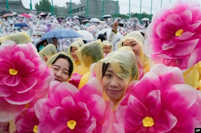 Buddhists wait for a lantern parade as part of festivities celebrating the birthday of Buddha, at Dongguk University in Seoul, South Korea, Saturday, May 11, 2024. (AP Photo/Ahn Young-joon)