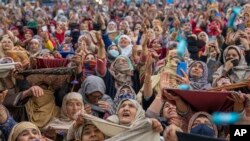 Kashmiri Muslim women pray as the head priest displays a relic at the Hazratbal shrine on the occasion of Mehraj-u-Alam, believed to mark the ascension of Prophet Muhammad to heaven, in Srinagar, Indian-controlled Kashmir.