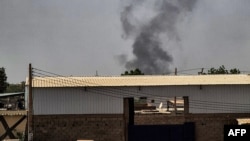 Smoke billows from a fire in a building in the center of Khartoum on May 25, 2023. 