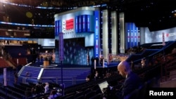 A journalist works during preparations at the United Center, the host venue of the Democratic National Convention in Chicago, Illinois, Aug. 18, 2024.