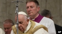 Pope Francis presides over the Easter vigil ceremony in St. Peter's Basilica at the Vatican, April 8, 2023. 