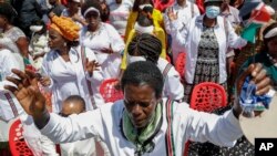 Kenyans attend a national day of prayer event held at Nyayo stadium in the capital Nairobi, Kenya, Tuesday, Feb. 14, 2023.