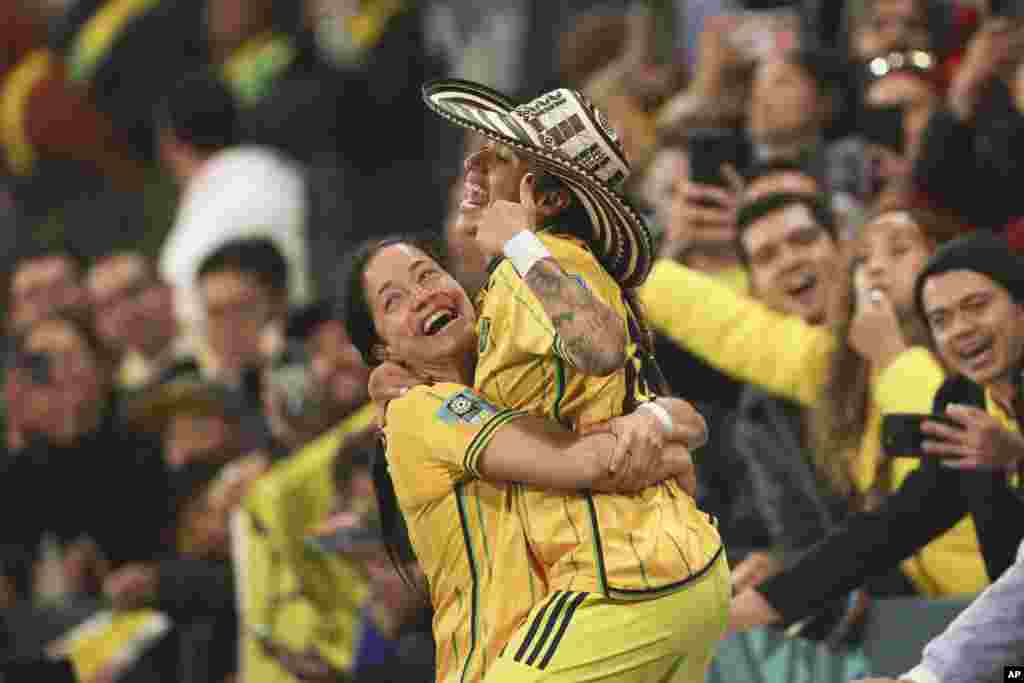 Colombia&#39;s Diana Ospina Garcia, left, and Carolina Arias celebrate at the end of the Women&#39;s World Cup round of 16 soccer match between Jamaica and Colombia in Melbourne, Australia.