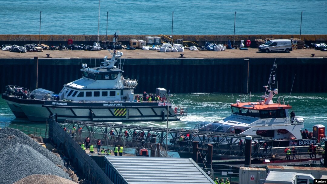 People believed to be migrants, disembark from a British Border Force vessel as they arrive at the Port of Dover in Dover, Britain, April 29, 2024.