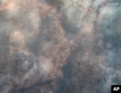 This image shows wildfires in Yellowknife, Northwest Territories, Canada on Aug. 15, 2023. (Satellite image ©2023 Maxar Technologies via AP)