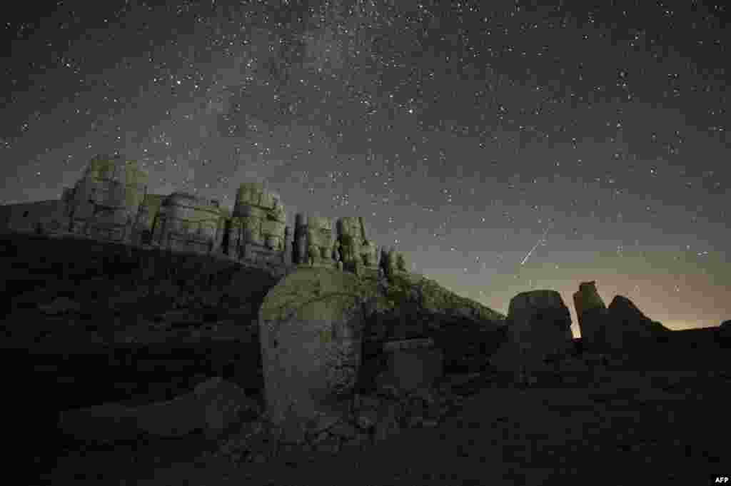 This photo shows the massive stone head sculptures at the archaeological site of Mount Nemrut in Adıyaman, southeastern Turkey, Aug. 11, 2024, the night of the Perseid meteor shower. 