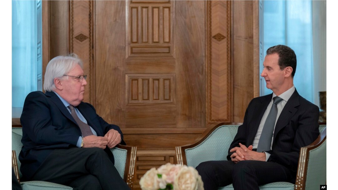 In this photo released on the official Facebook page of the Syrian Presidency, Syrian President Bashar al-Assad, right, meets with Martin Griffiths, United Nations Under-Secretary-General for Humanitarian Affairs, in Damascus, Syria, Feb. 13, 2023.
