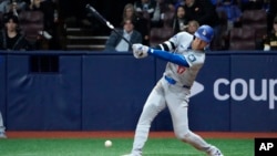 Los Angeles Dodgers designated hitter Shohei Ohtani grounds out during the seventh inning of an opening day baseball game against the San Diego Padres at the Gocheok Sky Dome in Seoul, South Korea, March 20, 2024. 