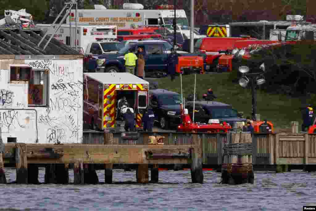 An injured sailor from Dali cargo vessel is loaded into an ambulance, after getting taken off the ship, following Francis Scott Key Bridge collapse, in Baltimore, March 26, 2024.