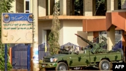 A vehicle of Sudan's Rapid Support Forces (RSF) paramilitaries is stationed outside the offices of Dar al-Mushaf (African Holy Koran Publishing House), in the south of Sudan's capital Khartoum on April 17, 2023.