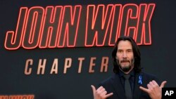 Keanu Reeves, star of "John Wick: Chapter 4," poses at the premiere of the film at the TCL Chinese Theatre in Los Angeles, March 20, 2023.