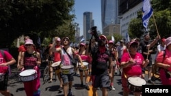 Protesters march to demand the release of hostages held in Gaza, during a day of protests marking nine months since the deadly October 7 attack, in Tel Aviv, Israel, July 7, 2024.