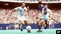 FILE - Franz Beckenbauer (6) of the New York Cosmos battles for the ball during a NASL soccer game, May 1, 1983 in East Rutherford, N.J. The German star, who died Jan. 7, 2024, played in the U.S. for four seasons beginning in 1977.