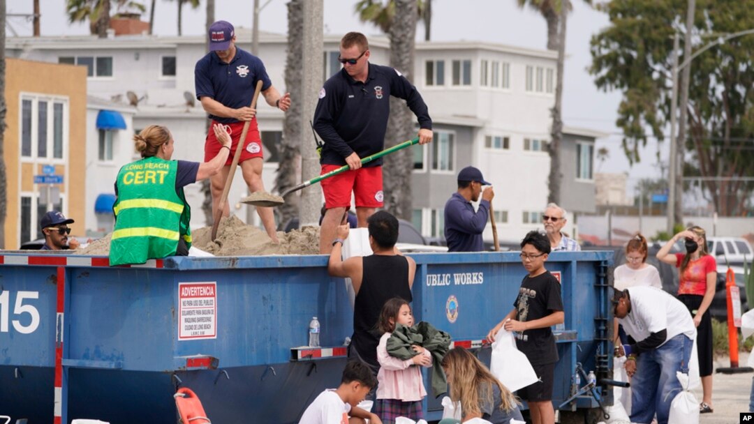 Long Beach lifeguards fill up sandbags for residents ahead of Hurricane Hilary in Long Beach, Calif., Aug. 19, 2023.