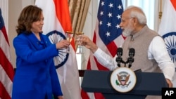 FILE - U.S. Vice President Kamala Harris offers a toast to Prime Minister Narendra Modi during the Indian leader's state visit to Washington, June 23, 2023.