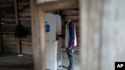 A man casts his ballot inside a polling station in Goma, eastern Democratic Republic of the Congo, Dec. 21, 2023.