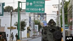 FILE - Members of the National Guard are seen in the border city of Matamoros, Tamaulipas state, Mexico, Aug. 24, 2021. Four U.S. citizens were assaulted and kidnapped on March 3, 2023, by unidentified gunmen after crossing into Matamoros, the FBI said.