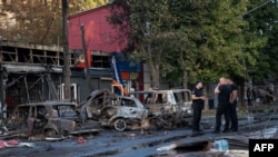 Burnt cars are seen at the site of a Russian airstrike at a market in Kostyantynivka, in Ukraine's eastern Donetsk region, Sept. 6, 2023.