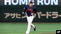 Shohei Ohtani of Japan rounds the bases after hitting a 3-run home run in the 1st inning against Australia during their Pool B game at the World Baseball Classic at the Tokyo Dome in Tokyo, March 12, 2023.