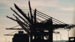 FILE - A docked container ship at the Port of Los Angeles, April 28, 2023. Los Angeles and Shanghai formed a partnership to create a green shipping corridor to cut carbon emissions.