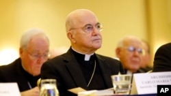 FILE - Archbishop Carlo Maria Vigano, apostolic nuncio to the US, listens to remarks at the US Conference of Catholic Bishops' annual fall meeting in Baltimore, Nov. 16, 2015. 