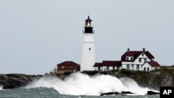 Waves crash against the rocks at Portland Head Light in South Portland, Maine, Sept. 15, 2023. The building is the oldest lighthouse in Maine.