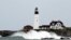 Waves crash against the rocks at Portland Head Light in South Portland, Maine, Sept. 15, 2023. The building is the oldest lighthouse in Maine.