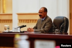 FILE - Eritrean President Isaias Afwerki attends a meeting at the Great Hall of the People, in Beijing, China, May 15, 2023.