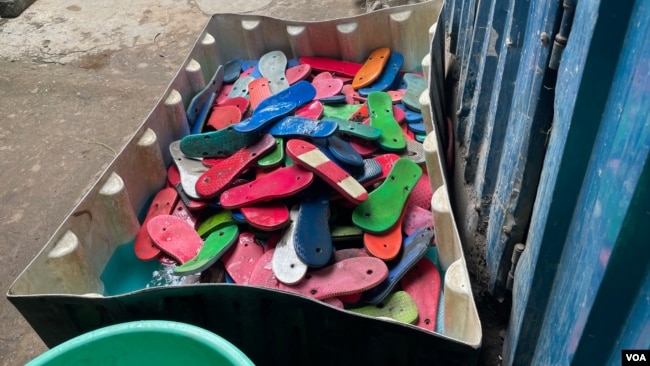 Discarded flip-flops are being washed as part of the upcycling process, at Ocean Sole, in Karen, Kenya, Jan. 17, 2024. (Mariama Diallo/VOA)