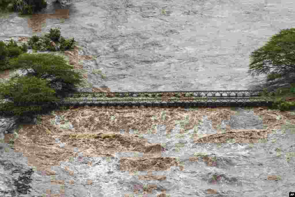 Flood waters cover a bridge in the flooded Maasai Mara National Reserve, that left dozens of tourists stranded in Narok County, Kenya.
