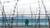 South Korean army soldiers patrol along the barbed-wire fence in Paju, South Korea, near the border with North Korea, Feb. 16, 2023. 