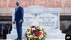 Kenyan President William Ruto pauses after laying a wreath at the tombs of Martin Luther King Jr., and Coretta Scott King, during a stop at the King Center in Atlanta, Georgia, May 20, 2024, as part of his state visit to the United States.