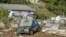 Damaged vehicles are seen in a cemetery after an extratropical cyclone hit southern Brazil, in Caraa, Rio Grande do Sul state, June 18, 2023.