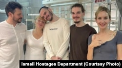 Israeli-Russian Andrei Kozlov, center, rescued from Gaza after 8 months in Hamas captivity, reunites with his family at Sheba Medical Center in Tel Aviv, Israel.
