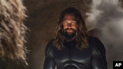 This image released by Warner Bros. Pictures shows Jason Momoa in a scene from "Aquaman and the Lost Kingdom." (Warner Bros. Pictures via AP)