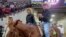 In this undated photo provided by Tyrone Tsosie, Tyrone Tsosie and his son, Tydon Tsosie, right, compete in the Indian National Finals Rodeo in Las Vegas.